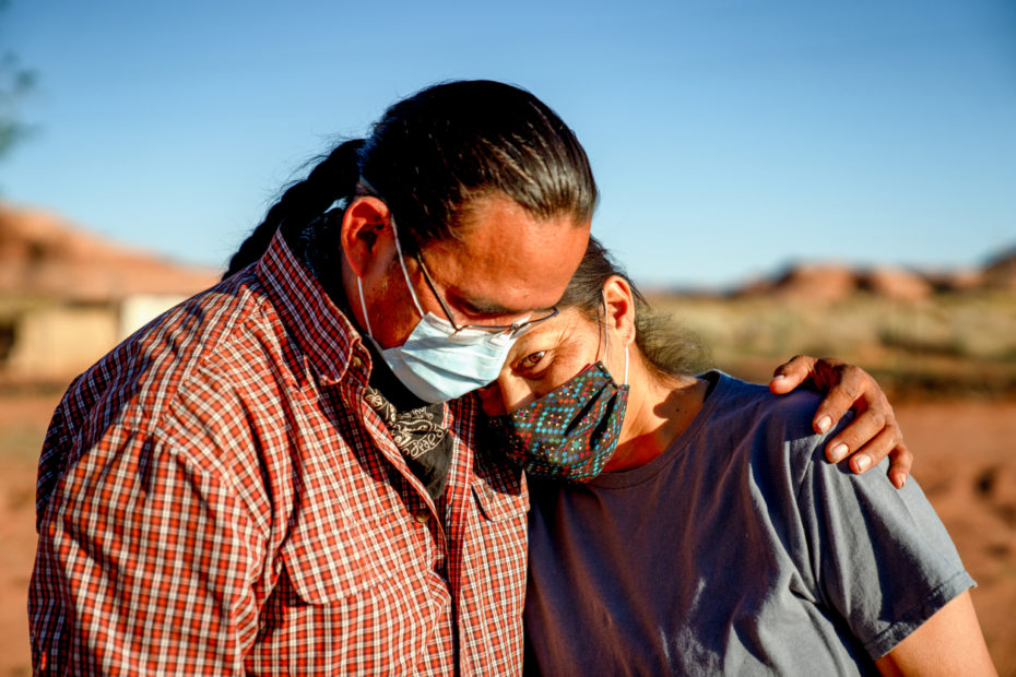 A Native man is comforting a Native woman.
